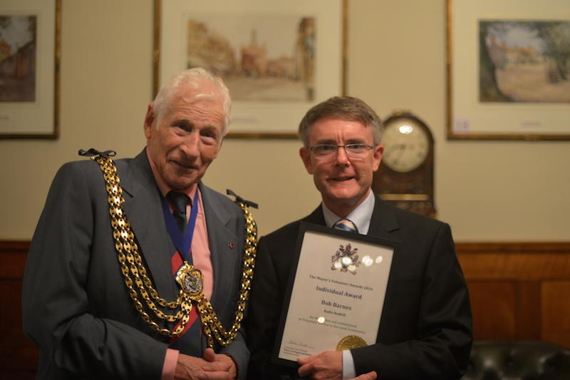 Cllr. David Powell presents Bob Barnes with his Mayor's Volunteer Award.